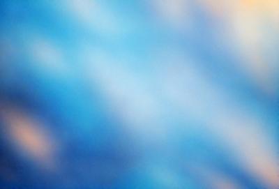 The primary subject of the image is a blue sky with a few clouds. The setting is a cloudy day, and the visual style is a photo. The dominant colors are blue and white, creating a calm and serene atmosphere.