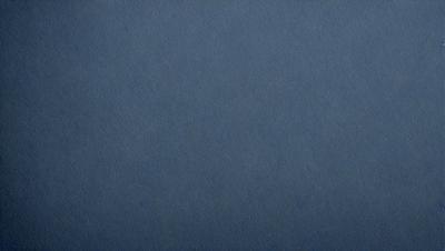 The primary subject of the image is a blue cloth, which is the main object, scene, or focus of the image. The setting or background is a blue cloth, and the visual style is a photo. The dominant colors and overall atmosphere are blue and calm.