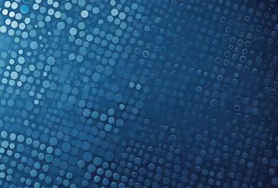 The primary subject of the image is a blue background with a pattern of white circles. The setting appears to be a dark, possibly underwater, environment. The visual style of the image is a combination of a photo and a digital art, as it features a close-up of the blue background with the white circles. The colors and mood of the image are predominantly dark and moody, with the blue background and white circles creating a sense of depth and intrigue.
