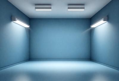 The primary subject of the image is a large, empty room with a blue wall. The setting is a room with a blue wall, and the visual style is a photo. The colors and mood of the image are predominantly blue, creating a calm and serene atmosphere.