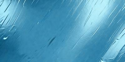 The primary subject of the image is a blue surface, which appears to be a piece of fabric or a wall with a blue tint. The setting is a room with a blue background, and the visual style is a close-up of the blue surface. The colors and mood of the image are predominantly blue, creating a calm and serene atmosphere.