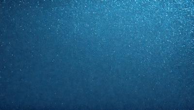 The primary subject of the image is a blue sky with a few stars visible. The setting is a clear night sky, and the visual style is a photo. The colors and mood of the image are predominantly blue, with a sense of calmness and tranquility.