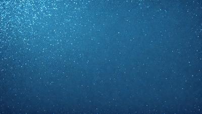 The primary subject of the image is a blue sky filled with sparkling stars. The setting is a vast, open space with no visible landmarks or objects. The visual style is a natural, outdoor scene with a focus on the night sky. The colors and mood are serene and peaceful, as the stars create a sense of wonder and tranquility.