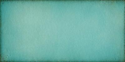 The primary subject of the image is a large, blue piece of paper. The setting is a white background, which provides a clean and uncluttered appearance. The visual style is a close-up of the blue paper, emphasizing its color and texture. The colors and mood of the image are predominantly blue, creating a calm and serene atmosphere.