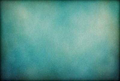 The primary subject of the image is a large, blue, textured surface. The setting is a dark, blue background, which creates a moody atmosphere. The visual style is a combination of a photo and a digital art, as it appears to be a close-up of a textured surface. The colors and mood of the image are predominantly dark and blue, giving it a somewhat mysterious and dramatic appearance.