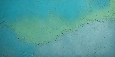 The primary subject of the image is a wall with a blue and green color scheme. The setting is a room with a blue and green color scheme. The visual style is a photo of a wall with a blue and green color scheme. The colors and mood of the image are predominantly blue and green, creating a calm and soothing atmosphere.