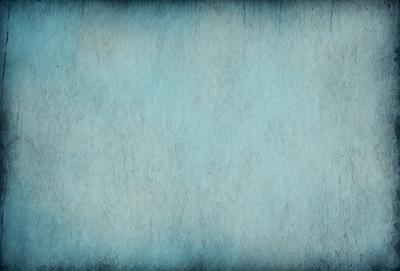The primary subject of the image is a blue wall with a textured surface. The setting is a room with a blue wall, and the visual style is a photo. The dominant colors are blue and white, creating a calm and serene atmosphere.