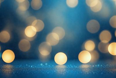 The primary subject of the image is a blue background with a pattern of bright lights, creating a visually appealing and luminous scene. The setting is a dark background, which contrasts with the bright lights, emphasizing their glow. The visual style is a combination of a photo and digital art, as the lights are arranged in a pattern that resembles a painting or digital artwork. The colors and mood of the image are predominantly blue, with the bright lights adding a sense of warmth and energy to the