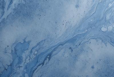 The primary subject of the image is a blue and white ocean wave. The setting is the ocean, with the wave crashing on the surface. The visual style is a photo of the ocean, capturing the beauty of the natural environment. The dominant colors are blue and white, creating a serene and calming atmosphere.