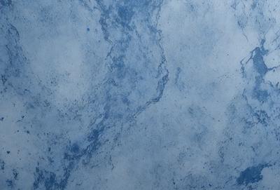 The primary subject of the image is a blue marble wall. The setting is a room with a blue marble wall, which serves as the background. The visual style is a photo, capturing the blue marble wall in detail. The colors and mood of the image are predominantly blue, creating a calm and serene atmosphere.