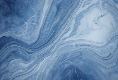 The primary subject of the image is a blue and white ocean wave. The setting is the ocean, with the wave rolling in. The visual style is a photo of the ocean, capturing the beauty of the waves. The dominant colors are blue and white, creating a serene and calming atmosphere.