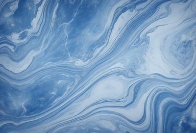 The primary subject of the image is a blue and white ocean wave. The setting is the ocean, with the wave crashing against the surface. The visual style is a photo of the ocean, capturing the beauty and power of the wave. The dominant colors are blue and white, creating a serene and calming atmosphere.