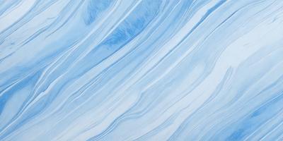 The primary subject of the image is a blue and white marbled tile. The setting is a bathroom, as the tile is placed on a wall. The visual style is a close-up of the tile, showcasing its intricate design. The dominant colors are blue and white, creating a calm and soothing atmosphere.