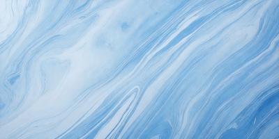 The primary subject of the image is a blue and white ocean wave. The setting is the ocean, with the wave rolling in. The visual style is a photo of the ocean, capturing the beauty of the waves. The dominant colors are blue and white, creating a serene and calming atmosphere.