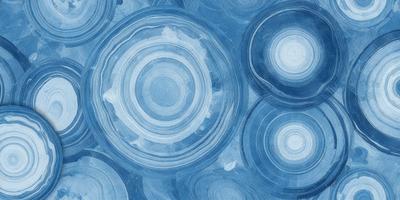 The primary subject of the image is a blue and white circular pattern. The setting is a blue background, and the visual style appears to be a combination of a photo and digital art. The dominant colors are blue and white, creating a calm and soothing atmosphere.