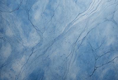 The primary subject of the image is a blue and white marble wall with a pattern of swirls and waves. The setting is a room with a blue and white marble floor. The visual style is a close-up of the marble wall, showcasing its intricate design. The colors and mood of the image are predominantly blue and white, creating a serene and elegant atmosphere.