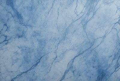 The primary subject of the image is a blue marble wall with a pattern of white veins. The setting is a room with a blue marble countertop. The visual style is a close-up of the marble wall, showcasing its unique texture and pattern. The colors and mood of the image are predominantly blue, with the white veins adding a touch of contrast and interest to the overall atmosphere.