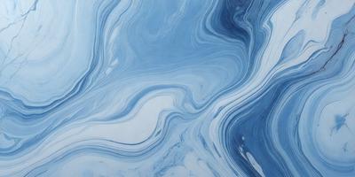 The primary subject of the image is a blue and white ocean wave. The setting is the ocean, with the wave being the main focus of the image. The visual style is a photo of the ocean, capturing the beauty of the wave. The dominant colors are blue and white, creating a serene and calming atmosphere.