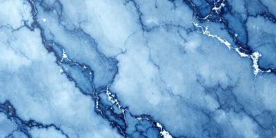 The primary subject of the image is a blue marble wall with a white and blue pattern. The setting is a room with a blue marble wall, and the visual style is a photo. The dominant colors are blue and white, creating a calm and serene atmosphere.