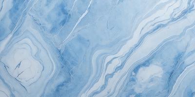 The primary subject of the image is a blue and white marble tile. The setting is a bathroom, with the marble tile covering the walls and floor. The visual style is a close-up of the tile, showcasing its intricate design and texture. The dominant colors are blue and white, creating a clean and elegant atmosphere.