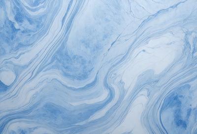 The primary subject of the image is a blue and white marbled surface, which appears to be a tile or a wall with a patterned design. The setting is a room with a blue and white color scheme, creating a calm and soothing atmosphere. The visual style is a close-up of the marbled surface, showcasing its intricate pattern and texture. The colors and mood of the image are predominantly blue and white, giving it a clean and elegant appearance.