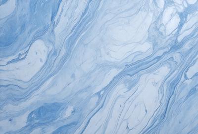 The primary subject of the image is a blue marble-like surface, which appears to be a patterned or textured material. The setting is a white background, which contrasts with the blue surface. The visual style of the image is a close-up of the blue surface, showcasing its intricate patterns and textures. The colors and mood of the image are predominantly blue, creating a calm and serene atmosphere.