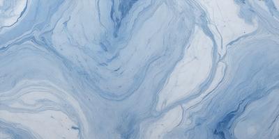 The primary subject of the image is a blue and white marbled pattern. The setting is a white surface, possibly a wall or a countertop. The visual style is a close-up of the marbled pattern, showcasing its intricate details. The colors and mood of the image are predominantly blue and white, creating a calm and serene atmosphere.
