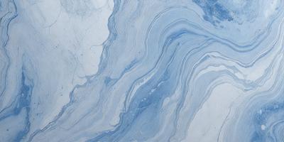 The primary subject of the image is a blue and white marbled surface, which appears to be a tile or a wall. The setting is a room with a blue and white marbled wall, and the visual style is a close-up of the marbled surface. The colors and mood of the image are predominantly blue and white, creating a calm and serene atmosphere.