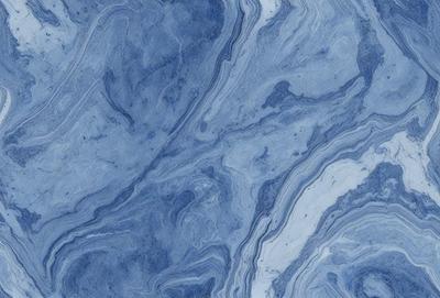 The primary subject of the image is a blue marble tile with a pattern of swirls and waves. The setting is a blue marble countertop, and the visual style is a close-up of the tile. The dominant colors are blue and white, creating a calm and soothing atmosphere.