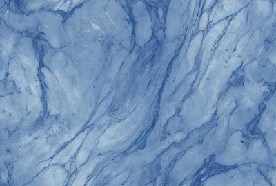 The primary subject of the image is a blue marble wall with a pattern of swirls and curves. The setting is a room with a blue marble floor, which complements the blue marble wall. The visual style is a close-up of the marble wall, showcasing its intricate design. The colors and mood of the image are predominantly blue, creating a serene and calming atmosphere.