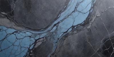 The primary subject of the image is a blue and grey marbled surface, which appears to be a stone or concrete wall. The setting is a dark room, and the visual style is a close-up of the marbled surface. The colors and mood of the image are predominantly dark and moody, with the blue and grey tones of the marbled surface creating a sense of depth and texture.