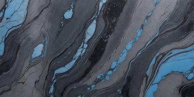 The primary subject of the image is a blue and black marbled stone. The setting is a close-up of the stone, showcasing its unique pattern and texture. The visual style is a realistic representation of the stone, capturing its natural beauty. The dominant colors are blue and black, creating a striking contrast and a moody atmosphere.