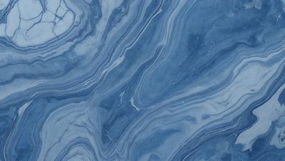 The primary subject of the image is a blue marble tile with a pattern of swirls and waves. The setting is a wall, and the visual style is a close-up of the tile. The dominant colors are blue and white, creating a calm and soothing atmosphere.