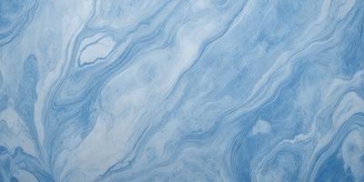 The primary subject of the image is a blue and white marbled wallpaper. The setting is a room with a blue and white marbled wallpapered wall. The visual style is a close-up of the wallpaper, showcasing its intricate design. The colors and mood of the image are predominantly blue and white, creating a calm and serene atmosphere.