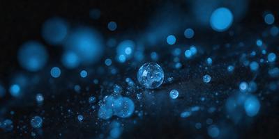 The primary subject of the image is a single blue bubble, which is the main focus of the scene. The setting is a dark background, which contrasts with the bright blue bubble. The visual style of the image is a close-up of the bubble, emphasizing its unique color and texture. The overall atmosphere of the image is serene and captivating, as the viewer's attention is drawn to the lone blue bubble.