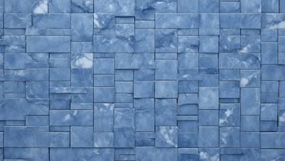 The primary subject of the image is a blue marble wall with a pattern of blue and white tiles. The setting is a room with a blue marble wall as the main focus. The visual style is a close-up of the blue marble wall, showcasing the intricate pattern of the tiles. The colors and mood of the image are predominantly blue, creating a calm and serene atmosphere.