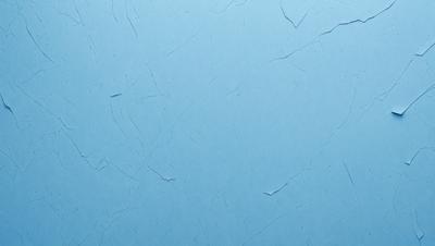 The primary subject of the image is a blue wall with a textured surface. The setting is a room with a blue background. The visual style is a close-up of the blue wall, which gives a sense of depth and texture. The colors and mood of the image are predominantly blue, creating a calm and serene atmosphere.