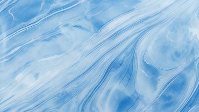 The primary subject of the image is a blue and white ocean wave. The setting is the ocean, with the wave rolling in. The visual style is a photo of the ocean, capturing the beauty of the wave. The dominant colors are blue and white, creating a serene and calming atmosphere.