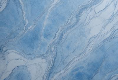 The primary subject of the image is a blue and white marble tile. The setting is a bathroom, with the marble tile covering the walls and floor. The visual style is a close-up of the tile, showcasing its intricate patterns and textures. The dominant colors are blue and white, creating a clean and elegant atmosphere.