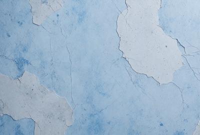The primary subject of the image is a blue wall with white chips and cracks. The setting is a room with a blue background. The visual style is a close-up of the wall, showcasing the chips and cracks. The colors and mood of the image are predominantly blue and white, giving it a calm and serene atmosphere.