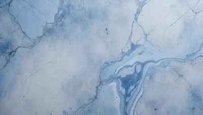 The primary subject of the image is a blue and white marble-like surface, which appears to be a wall or a countertop. The setting is a room with a blue and white color scheme. The visual style is a close-up of the marble surface, showcasing its intricate patterns and textures. The colors and mood of the image are predominantly blue and white, creating a calm and serene atmosphere.