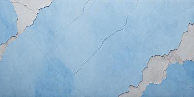 The primary subject of the image is a blue wall with a cracked surface. The setting is a room with a blue background. The visual style is a photo of a cracked blue wall. The dominant colors are blue and white, creating a calm and soothing atmosphere.