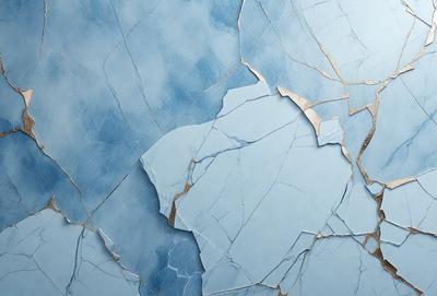 The primary subject of the image is a blue wall with a cracked and chipped appearance. The setting is a room with a blue background. The visual style is a close-up of the wall, showcasing the cracks and chips. The colors and mood of the image are predominantly blue, giving it a calm and serene atmosphere.