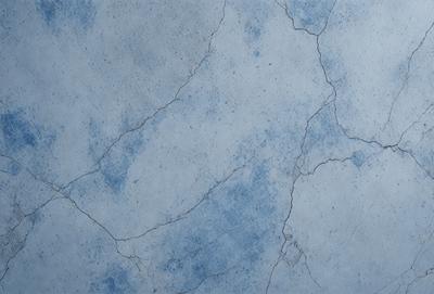 The primary subject of the image is a blue and white marble wall. The setting is a room with a blue and white marble wall, which serves as the background. The visual style is a photo, capturing the details of the marble wall. The colors and mood of the image are predominantly blue and white, creating a calm and elegant atmosphere.