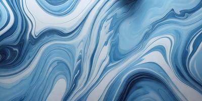 The primary subject of the image is a blue and white ocean wave. The setting is the ocean, with the wave being the main focus of the image. The visual style is a photo of the ocean, capturing the beauty of the waves. The dominant colors are blue and white, creating a serene and calming atmosphere.