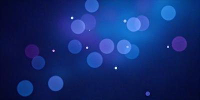 The primary subject of the image is a blue background with a pattern of white dots. The setting appears to be a night sky, creating a serene and peaceful atmosphere. The visual style of the image is a combination of a photo and digital art, as it features a blend of natural elements and artistic design. The colors and mood of the image are predominantly blue and white, with the white dots adding a touch of brightness and contrast to the overall scene.