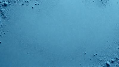 The primary subject of the image is a large, blue, smooth surface. The setting is a blue background, which creates a visually striking contrast with the blue surface. The visual style is a close-up of the blue surface, showcasing its texture and color. The colors and mood of the image are predominantly blue, giving it a calm and serene atmosphere.