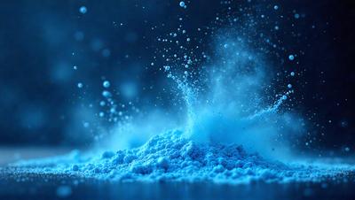 The primary subject of the image is a blue powder, which appears to be a fine, powdery substance. The setting is a dark blue background, which contrasts with the blue powder. The visual style of the image is a close-up of the powder, showcasing its texture and color. The overall atmosphere of the image is one of mystery and intrigue, as the powder appears to be floating or falling in the dark blue background.
