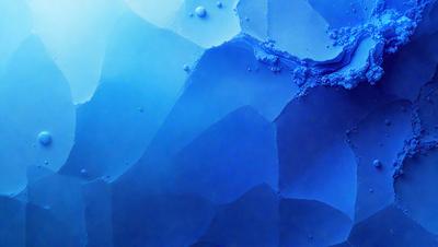 The primary subject of the image is a blue background with a pattern of white bubbles. The setting appears to be a dark room, and the visual style is a combination of a photo and digital art. The dominant colors are blue and white, creating a calm and soothing atmosphere.