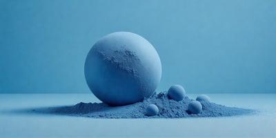 The primary subject of the image is a blue ball, which is the main object in the scene. The setting is a blue background, which creates a visually appealing contrast with the blue ball. The visual style of the image is a photo, capturing the details of the blue ball and its surroundings. The colors and mood of the image are predominantly blue, giving it a calm and serene atmosphere.